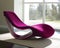 A unique magenta shaped chaise lounge chair with a curved frame. Trendy color of 2023 Viva Magenta.. AI generation