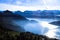 Unique panaramic skyline view of Swiss Alps towering over misty Vierwaldstattersee, Vitznau, Lake Lucern, Switzerland