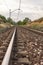 Unique railroad line at the sunset. Train railway track . Low clouds over the railroad