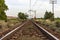 Unique railroad line at the sunset. Train railway track . Low clouds over the railroad