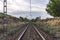 Unique railroad line at the sunset. Train railway track . Low clouds over the railroad