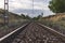 Unique railroad line at the sunset. Train railway track . Low clouds over the railroad