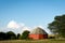 Unique round red barn surrounded by open farmland in rural Illinois.