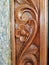 Unique structural design of a door, the door made of wood is carved and polished for better appearance of home.