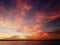 A unique sunset on the shore of the lake with red clouds