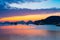 Unique sunset sky in Vietnam Cat Ba bay with floating fishing boat village on sea, cloudscape tropical weather, long exposure