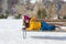 Unique Winter holidays trip to amazing snow valley - young happy and beautiful Asian woman playful on bench alone enjoying snowy