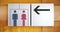 Unisex restroom or toilet and arrow sign