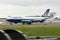 United Airlines Boeing 747 in motion on runway.