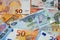 United Arab of Emirates dirhams money banknote bills with European euro banknotes background