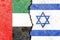 United Arab Emirates vs Israel flags on cracked wall, political conflict concept