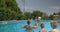 United Family Playing Inflatable Ball in Home Pool