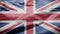 United Kingdom flag waving in the wind. Close up of Britain banner blowing