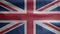 United Kingdom flag waving in the wind. Close up of Britain banner blowing soft and smooth silk. Cloth fabric texture ensign