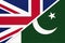 United Kingdom vs Pakistan national flag from textile. Relationship between two european and asian countries