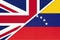 United Kingdom vs Venezuela national flag from textile. Relationship between two european and american countries