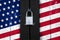 United states of america flag on a door with a padlock, protect