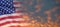 United States of America flag on sky at sunset or sunrise background.