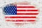 United states of america flag on white brick wall background, painted with watercolor effect