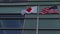 United States of America and Japanese flags flying side by side together