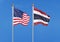 United States of America vs Thailand. Thick colored silky flags of America and Argentina. 3D illustration on sky background. â€“