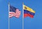 United States of America vs Venezuela. Thick colored silky flags of America and Argentina. 3D illustration on sky background. â€“