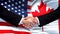 United States and Canada handshake, international friendship, flag background