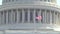 United States Capital - Close-up of the American Flag flying in the wind on the Capital Building