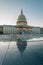 The United States Capitol reflecting in glass, in Washington, DC