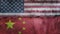 United States and China flag on cracked wall background. Economics, politics conflicts, war concept texture background