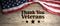 United States flag with thank you veterans message. Wooden background. 3d illustration