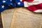 United States founding documents on a vintage American flag