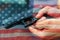 United States Gun Laws - Guns and weapons. A hand of man practicing firing using a Glock gun model at the shooting range. Fire