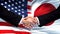 United States and Japan handshake, international friendship, flag background