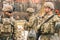 United States Marine Corps soldiers with weapons, helmets and armored vehicle humvee