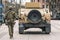 United States Marine Corps soldiers with weapons, helmets and armored vehicles humvee