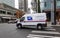 A United States Postal Service Truck making deliveries in an urban area