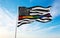 United states thin rainbow line pride flag waving in the wind at cloudy sky. Freedom and love concept. Pride month. activism,