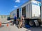 A United Van Lines moving truck with the mover unloading the truck