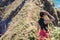 Unity with nature. Girl on background of beautiful wildlife, sea and rocks