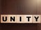 Unity Spelled in Blocks on a Leather Holy Bible