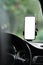 Universal mount holder with smart phone on windshield of automobile for GPS. White empty screen for text