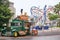 Universal Studio, Singapore - March 27, 2013: A man buying snacks and drink at a green food truck in the street at universal studi