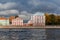 Universitetskaya embankment in St. Petersburg. Facade of houses. View from the water. Sunny day. Autumn