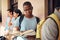 University, education and black man reading a book in the campus hallway waiting for class. Focus, learning and African