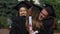 University friends hugging warmly, congratulations on successful graduation