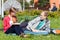 University friends sitting on the grass