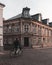 A university student is stressed and cycles by really fast on the cobblestoned streets of the old parts of Lund, Sweden