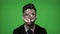University student using augmented reality having chemistry hologram formula projected on his face on green screen background -