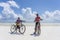 Unknown boys with a bicycle on a sandy beach at low tide on the island of Zanzibar, Tanzania, East Africa